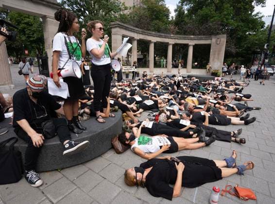 September 7, 2023, Montreal, PQ, Canada: Quebec actress Isabelle Blais, 2nd left in white, reads childrenöÄÃ s names as people stage a öÄudie-inöÄÃ¹ to demand cleaner air during a protest at McGill UniversityöÄÃ s Roddick Gates in front of the office of Quebec Premier Francois Legault in Montreal, Thursday, Sept. 7, 2023. Montreal Canada  - ZUMAc35_ 20230907_zaf_c35_071 Copyright: xRyanxRemiorzx
