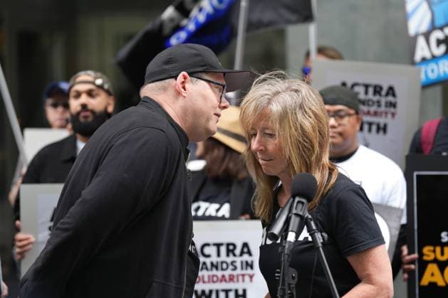 September 9, 2023, Toronto, ON, CAN: Marie Kelly (left) National Executive Director of the Alliance of Canadian Cinema Television Radio Artists (ACTRA) talks to Duncan Crabtree-Ireland, the Screen Actors Guild - American Federation of Television and Radio Artists (SAG-AFTRA) Chief Negotiator, as the unions hold a joint rally outside the Canadian headquarters of Amazon and Apple in Toronto, Saturday, Sept. 9, 2023, to protest corporate greed that is diminishing the livelihoods of their members. Toronto CAN - ZUMAc35_ 20230909_zaf_c35_047 Copyright: xChrisxYoungx