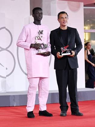 Venice, 80th Venice Film Festival 2023 - evening 11. Red Carpet Awardees In the photo: Seydou Sarr and Matteo Garrone  Copyright: xManuelexMangiarottix xipa-agencyx xPoolxPhotoxEventsx02x IPA_IPA40180492