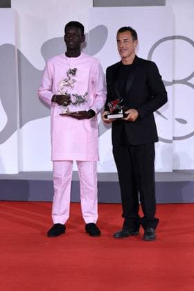80th Venice Film Festival 2023, Awards ceremony - Awards ceremony 80th Venice Film Festival 2023, Awards ceremony - Awards ceremony . Pictured: Matteo Garrone, Seydou Sarr SILVER LION AWARD FOR BEST DIRECTOR to: Matteo Garrone for the film I CAPITANO Venice Italy  Copyright: xIPA ABACAx BRIPA20230909_1021 IPA ABACAx BRIPA20230909_1021