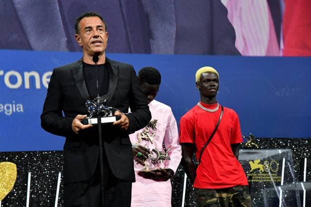 80th Venice Film Festival 2023, Awards ceremony - Awards ceremony 80th Venice Film Festival 2023, Awards ceremony - Awards ceremony . Pictured: Garrone, Mamadou Kouassi, Seydou Sarr SILVER LION AWARD FOR BEST DIRECTOR to: Matteo Garrone for the film I CAPITANO Venice Italy  Copyright: xIPA ABACAx BRIPA20230909_1165 IPA ABACAx BRIPA20230909_1165
