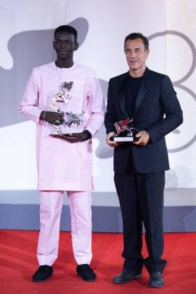 Venice Winners Red Carpet Seydou Sarr and Matteo Garrone pose with the Silver Lion for Best Director and the Marcello Mastroianni Award for Best New Young Actor or Actress for ?Io Capitano? during the Winners Red Carpet as part of the 80th Venice Film Festival (Mostra) in Venice, Italy on September 09, 2023. Photo by Aurore Marechal ABACAPRESS.COM Venice Italy  Copyright: xMarechalxAurore ABACAx 867017_006 MarechalxAurore ABACAx 867017_006