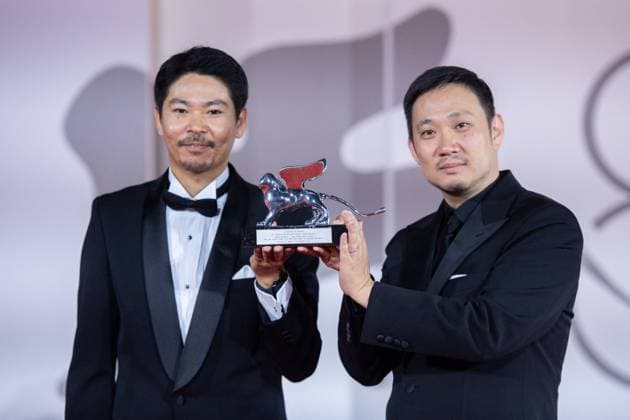 Venice Winners Red Carpet Hitoshi Omika and Ryusuke Hamaguchi pose with the Silver Lion Grand Jury Prize Award for Evil Does Not Exist during the Winners Red Carpet as part of the 80th Venice Film Festival (Mostra) in Venice, Italy on September 09, 2023. Photo by Aurore Marechal ABACAPRESS.COM Venice Italy  Copyright: xMarechalxAurore ABACAx 867017_043 MarechalxAurore ABACAx 867017_043
