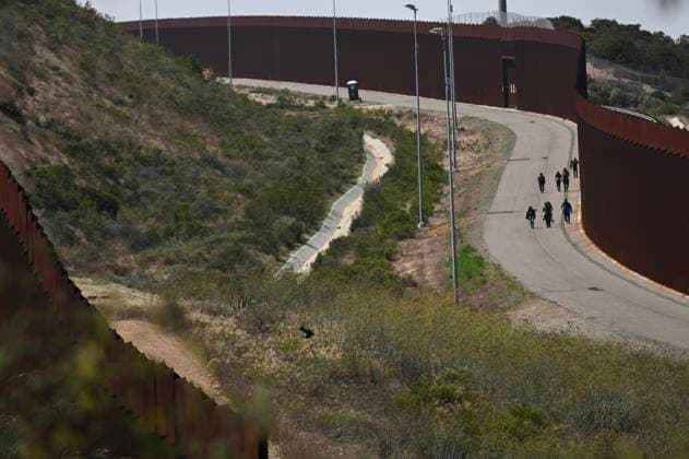 September 12, 2023, Tijuana, Baja California, Mexico: Around a hundred people are stuck between the two US-Mexico border fences dividing Tijuana and San Diego on Tuesday, September 12, 2023, as viewed from Tijuana, Mexico. Tijuana Mexico - ZUMAm180 20230912_zip_m180_003 Copyright: xCarlosxA.xMorenox