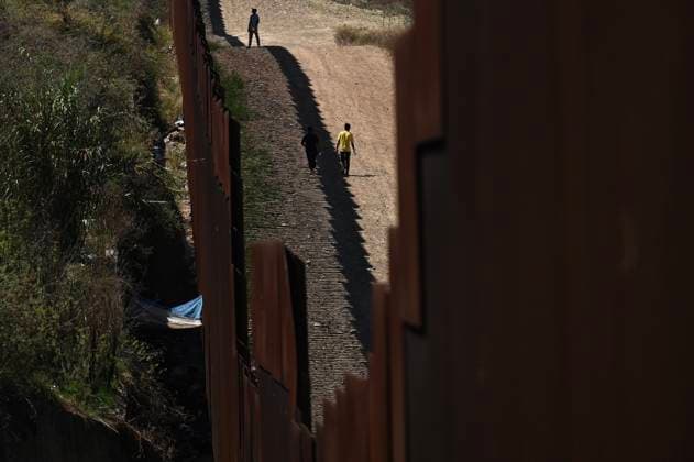 September 12, 2023, Tijuana, Baja California, Mexico: Around a hundred people are stuck between the two US-Mexico border fences dividing Tijuana and San Diego on Tuesday, September 12, 2023, as viewed from Tijuana, Mexico. Tijuana Mexico - ZUMAm180 20230912_zip_m180_015 Copyright: xCarlosxA.xMorenox