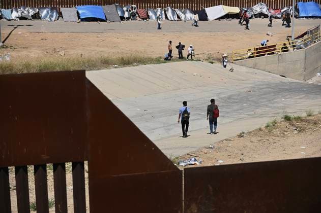 September 12, 2023, Tijuana, Baja California, Mexico: Around a hundred people are stuck between the two US-Mexico border fences dividing Tijuana and San Diego on Tuesday, September 12, 2023, as viewed from Tijuana, Mexico. The migrants are from countries in South America, Central Asia, Eastern Europe and Africa. All are seeking a chance to enter the US via asylum status, as some lost patience in the process of getting appointments through the CBP One application and crossed illegally out of desperation, some waiting months. Migrants claim that the appointment system is over saturated and is difficult to obtain access on the phone app. Tijuana Mexico - ZUMAm180 20230912_zip_m180_001 Copyright: xCarlosxA.xMorenox