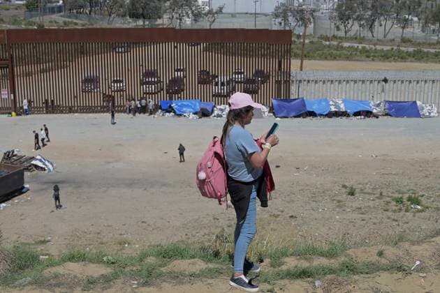 September 12, 2023, Tijuana, Baja California, Mexico: Around a hundred people are stuck between the two US-Mexico border fences dividing Tijuana and San Diego on Tuesday, September 12, 2023, as viewed from Tijuana, Mexico. US officials along the border with Mexico processed 183,000 plus migrants this July, as illegal crossings jumped by 33 percent after dropping to a two-year low in June, a month after the Title 42 migrant policy rescinded on May 12, despite record high heat levels, according to government statistics. Tijuana Mexico - ZUMAm180 20230912_zip_m180_011 Copyright: xCarlosxA.xMorenox