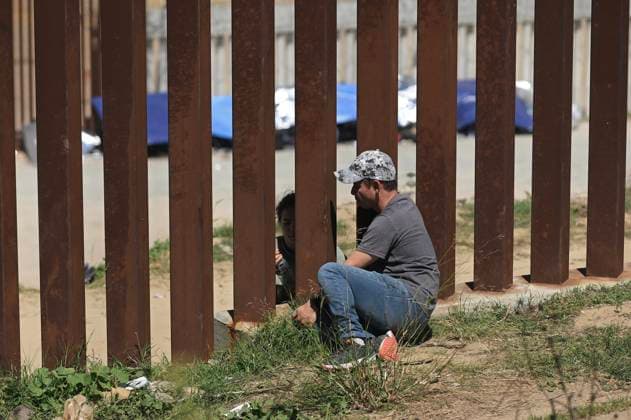 September 12, 2023, Tijuana, Baja California, Mexico: Around a hundred people are stuck between the two US-Mexico border fences dividing Tijuana and San Diego on Tuesday, September 12, 2023, as viewed from Tijuana, Mexico. The migrants are from countries in South America, Central Asia, Eastern Europe and Africa. All are seeking a chance to enter the US via asylum status, as some lost patience in the process of getting appointments through the CBP One application and crossed illegally out of desperation, some waiting months. Migrants claim that the appointment system is over saturated and is difficult to obtain access on the phone app. Tijuana Mexico - ZUMAm180 20230912_zip_m180_017 Copyright: xCarlosxA.xMorenox