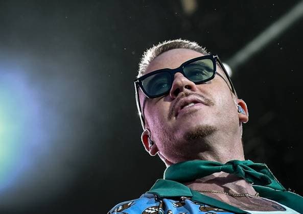 10 09 2023, xlakx, entertainment music, Lollapalooza Berlin emspor, v l Singer Macklemore performs on stage at the Lollapalooza Festival at Berlins Olympiastadion The 7 edition of the music festival in Berlin will take place from 09 09 2023 10 09 2023 Berlin