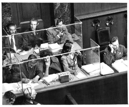 RECORD DATE NOT STATED Looking down on interpreters corner; in front, verbatim from the court floor is translated into English, section in rear translates into French; at extreme right end is Lt. Walter Selogson, monitor. . Photographs relating to Major Nuremberg Trials Copyright: xpiemagsx piemagsnanuremtri13062023-3 !ACHTUNG AUFNAHMEDATUM GESCHÄTZT!