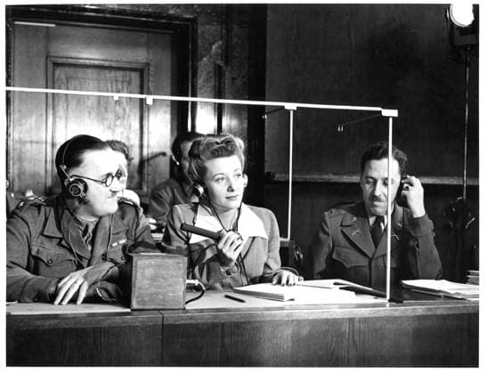 RECORD DATE NOT STATED Interpreters section, left to right: Captain Macintosh, British Army, translates from French into English; Miss Margot Bortlin, translates from German into English; Lt. Ernest P. Uiberall, Monitor. . Photographs relating to Major Nuremberg Trials Copyright: xpiemagsx piemagsnanuremtri13062023-4 !ACHTUNG AUFNAHMEDATUM GESCHÄTZT!