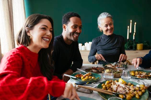 Smiling family having dinner together in dining room model released, Symbolfoto property released, EBSF03808