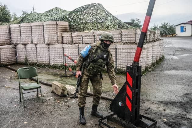 AZERBAIJAN, SHUSHA DISTRICT - SEPTEMBER 25, 2023: A serviceman of the Russian peacekeeping force stands guard at a checkpoint at the entrance in the Lachin Corridor. Sergei Savostyanov TASS  62631751