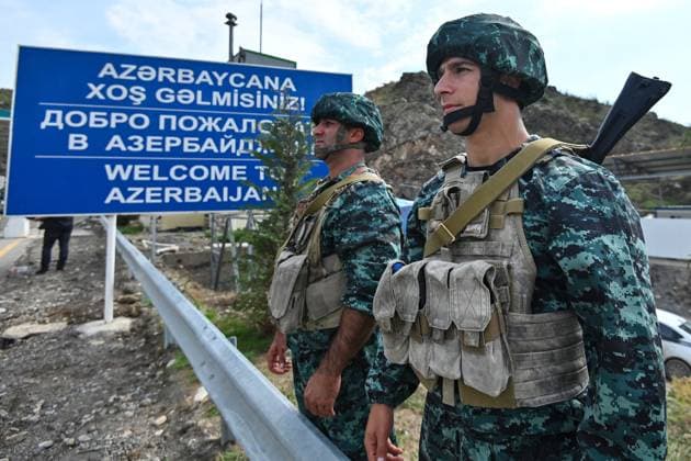 Azerbaijan Armenia Tensions Checkpoint 8524821 26.09.2023 Azerbaijani border service officers stand guard at the Lachin checkpoint at the entrance to the Lachin Corridor, the only road leading from the breakaway region of Nagorno-Karabakh to Armenia, in Azerbaijan. 13,350 evacuees entered Armenia from Nagorno-Karabakh after Azerbaijan launched counterterrorism activities in the breakaway region last week, the Armenian government said on September 26. Murad Orujov Sputnik Azerbaijan  Copyright: xMuradxOrujovx
