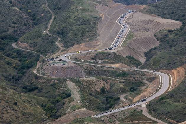 Armenia Azerbaijan Tensions Evacuees 8524980 26.09.2023 An aerial view shows cars moving along the Lachin Corridor, Lachin Corridor, the only road leading from the breakaway region of Nagorno-Karabakh to Armenia, in Syunik Province, Armenia. 13,350 evacuees entered Armenia from Nagorno-Karabakh after Azerbaijan launched counterterrorism activities in the breakaway region last week, the Armenian government said on September 26. Grigoriy Pechorin Sputnik Syunik Province Armenia  Copyright: xGrigoriyxPechorinx