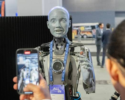 September 27, 2023, Montreal, PQ, Canada: People take photos of an AI robot at the All In artificial intelligence conference Wednesday, September 27, 2023 in Montreal. Montreal Canada - ZUMAc35_ 20230927_zaf_c35_018 Copyright: xRyanxRemiorzx