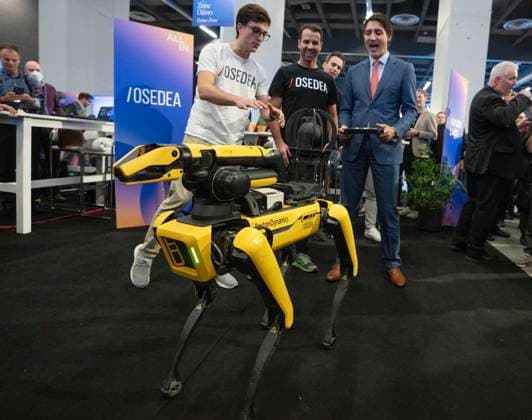 September 28, 2023, Montreal, PQ, Canada: Prime Minister Justin Trudeau controls a robotic dog at the All In artificial intelligence conference Thursday, September 28, 2023 in Montreal. Montreal Canada  - ZUMAc35_ 20230928_zaf_c35_079 Copyright: xRyanxRemiorzx