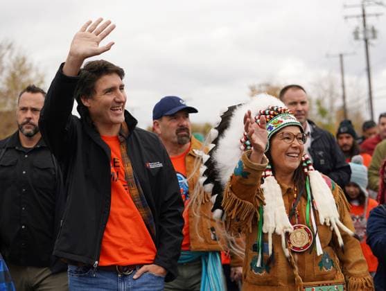 September 30, 2023, La Ronge, SK, Canada: Prime Minister Justin Trudeau, left, and Lac La Ronge Indian Band Chief Tammy Cook-Searson, right, wave at spectators during an awareness march on National Day for Truth and Reconciliation in La Ronge, Sask., on Saturday, September 30, 2023. La Ronge Canada - ZUMAc35_ 20230930_zaf_c35_025 Copyright: xHeywoodxYux