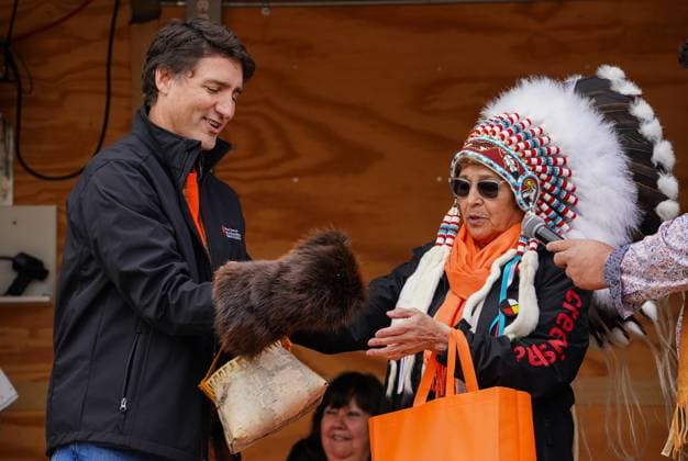 September 30, 2023, La Ronge, SK, Canada: Prime Minister Justin Trudeau, left, was presented a mitt made of beaver pelt by Montreal Lake Cree Nation Chief Joyce McLeod on National Day for Truth and Reconciliation in La Ronge, Sask., on Saturday, September 30, 2023. La Ronge Canada - ZUMAc35_ 20230930_zaf_c35_091 Copyright: xHeywoodxYux