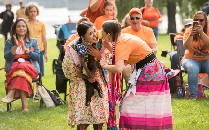 September 30, 2023, Fredericton, NB, CANADA: Aboriginal dancers have a laugh participating in a Potato Dance at a community gathering that was held to focus on healing and celebrating Indigenous culture and music as part of the Truth and Reconciliation Day on the Sitansisk (St. Marys First Nation) Pow Wow Grounds in Fredericton, New Brunswick on Saturday September 30, 2023. The dancers canöÄÃ t touch the potato with their hands as they attempt to keep it between them while still dancing. Fredericton CANADA  - ZUMAc35_ 20230930_zaf_c35_113 Copyright: xStephenxMacgillivrayx