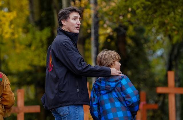 September 30, 2023, La Ronge, SK, Canada: Prime Minister Justin Trudeau, left, and his son Hadrien, right, look on while visiting a cemetery on National Day for Truth and Reconciliation in La Ronge, Sask., Saturday, Sept. 30, 2023. La Ronge Canada - ZUMAc35_ 20230930_zaf_c35_121 Copyright: xHeywoodxYux