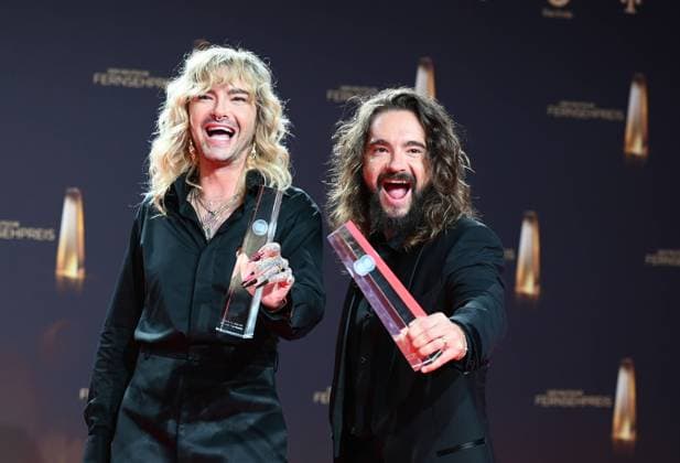 Bill Kaulitz and Tom Kaulitz pose with award for category Best Entertainment Show, Thats my Jam at gala and award ceremony of the German Television Award in Cologne
