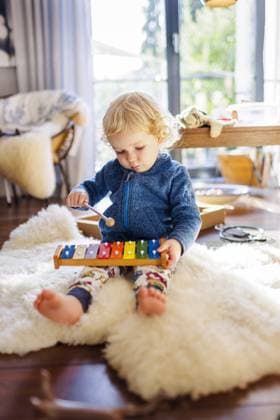 Thrma toddler playing a xylophone Bonn Germany Copyright: xUtexGrabowskyx