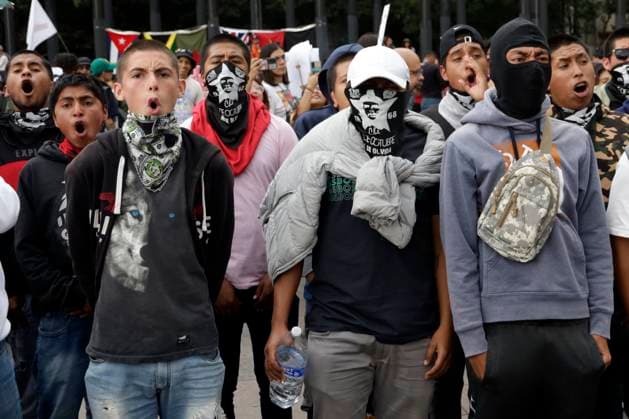 October 2, 2023, Mexico City, Mexico: Students from the Ayotzinapa Normal School participate in the commemoration of the 55th anniversary of the Tlatelolco massacre in the Plaza of the Three Cultures in Mexico City. on October 2, 2023 in Mexico City, Mexico Mexico City Mexico - ZUMAe321 20231002_zia_e321_019 Copyright: xLuisxBarronx