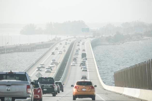 October 3, 2023, St. Petersburg, Florida, USA: A smokey haze falls over the Sunshine Skyway Bridge on Tuesday, Oct 3, 2023, heading north into St. Petersburg where smoke from a Canadian wildfire ended up in Florida due to winds from a combination of a low-pressure system and a high-pressure system over the eastern U.S., which has carries the smoke as far south as Miami. St. Petersburg USA - ZUMAs70_ 20231003_zan_s70_100 Copyright: xDouglasxR.xCliffordx
