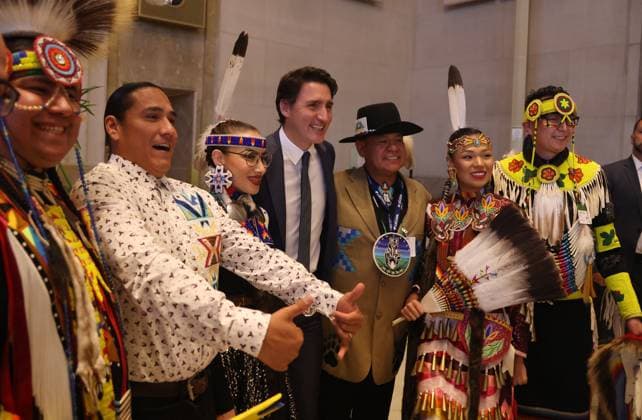 October 3, 2023, Ottawa, ON, Canada: Prime Minister Justin Trudeau poses for a photo with the Eaglestar Dance Troupe from Calgary at the One Alberta. One Canada. reception in Ottawa on Tuesday, October 3, 2023. Ottawa Canada  - ZUMAc35_ 20231003_zaf_c35_198 Copyright: xPatrickxDoylex