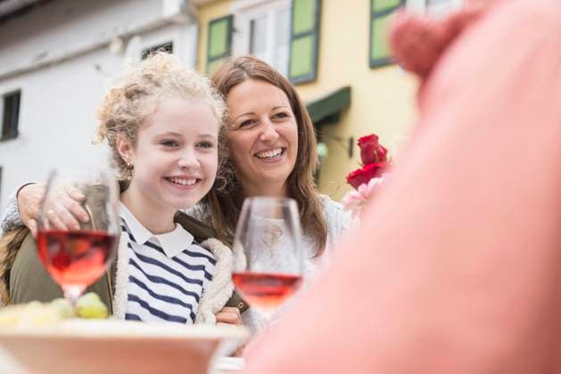 Mother arm around her teenage daughter and enjoying outdoor party at farmhouse, Bavaria, Germany Bavaria, Germany CR_DRNI151010-02679-01 ,model released, Symbolfoto ,property released