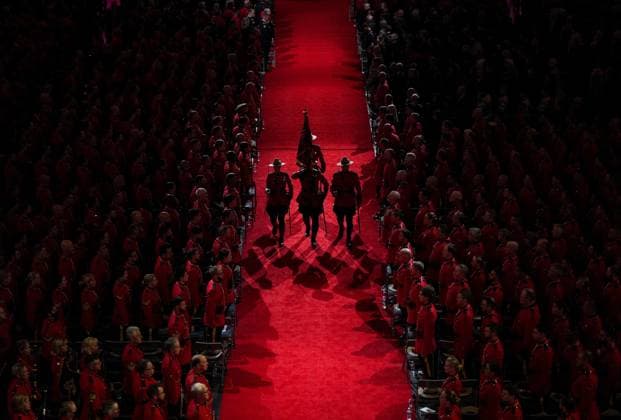 October 4, 2023, LANGLEY, BC, CANADA: RCMP officers are silhouetted as they march off the Guidon (flag) during a regimental funeral for RCMP Const. Rick O Brien in Langley, B.C., on Wednesday, October 4, 2023. O Brien, 51, was killed last month while executing a search warrant at a home in Coquitlam. A guidon is a flag that is traditionally used to designate a military unit. The RCMP s Guidon honours all officers whether or not in uniform and bears the service s operational honours. LANGLEY CANADA - ZUMAc35_ 20231004_zaf_c35_104 Copyright: xDarrylxDyckx