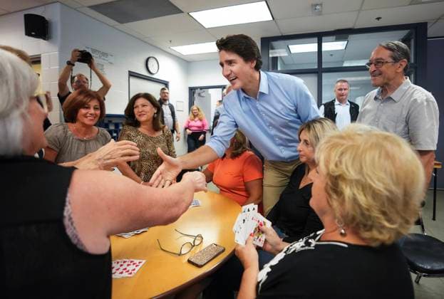 October 5, 2023, WOODBRIDGE, ON, CANADA: Canadian Prime Minister Justin Trudeau talks with seniors playing cards while visiting a community centre in the Vaughan, Ont., town of Woodbridge, Thursday, Oct. 5, 2023. WOODBRIDGE CANADA  - ZUMAc35_ 20231005_zaf_c35_056 Copyright: xNathanxDenettex