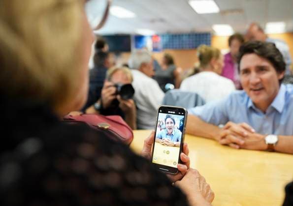 October 5, 2023, WOODBRIDGE, ON, CANADA: Canadian Prime Minister Justin Trudeau talks with seniors playing cards while visiting a community centre in the Vaughan, Ont., town of Woodbridge, Thursday, Oct. 5, 2023. WOODBRIDGE CANADA  - ZUMAc35_ 20231005_zaf_c35_057 Copyright: xNathanxDenettex