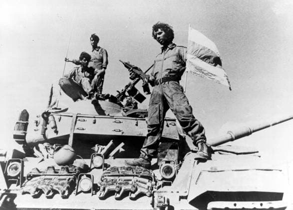 Oct 01, 1973 - Golan Heights, Israel - Also known as the Fourth Arab-Israeli War, Yom Kippur War was fought from October 6 to October 26, 1973 by a coalition of Arab states led by Egypt and Syria against Israel. The war began with a surprise joint attack by Egypt and Syria on the Jewish holiday of Yom Kippur. Egypt and Syria crossed the cease-fire lines in the Sinai and Golan Heights, respectively, which had been captured by Israel in 1967 during the Six-Day War. Many Arab states contributed troops and financial support, and the USSR also provided assistance but ultimately the Arabs buckled under a sustained Israeli counter-attack strengthened by US airlifts. PICTURED: An Israeli soldier on a tank. Golan Heights Israel - ZUMAk09_ 19731001_nin_k09_792 Copyright: xKeystonexPressxAgencyx