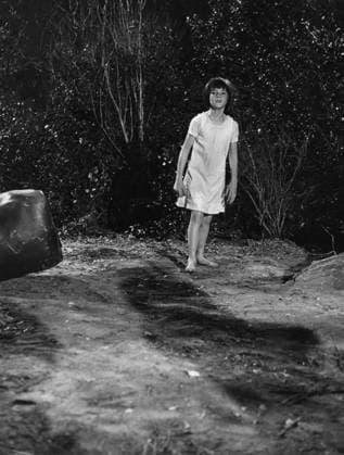 Film To Kill A Mockingbird Actress Mary Badham in a scene of the film Monroeville, Alabama USA  Copyright: xLeoxFuchsx 1083 Mary Badham Scout alone woods (To Kill a Mockingbird)