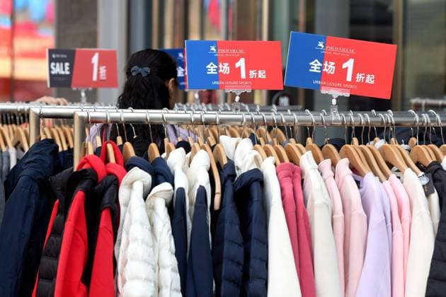 Clothes Sold at a 10 Percent Discount at a Store in Qingdao QINGDAO, CHINA - OCTOBER 14, 2023 - Clothes are sold at a 10 percent discount at a brand store in Qingdao, east China s Shandong province, Oct 14, 2023. Qingdao Shandong China  Copyright: xCFOTOx originalFilename: cfoto-clothess231014_np8qv.jpg