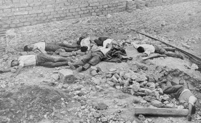 RECORD DATE NOT STATED CASUALTIES AT IRUN Bodies strew the streets when the Nationalists (falangists and royalists who oppose the republican government) take Irun, close to the French frontier. Date: 1936  Copyright: Gemini Picture No. 10199027