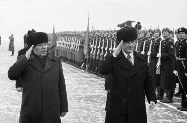 Moscow, USSR. General Secretary of the Central Committee of the CPSU, Chairman of the Presidium of the Supreme Soviet of the USSR Leonid Brezhnev and General Secretary of the Arab Socialist Ba th Party, President of the Syrian Arab Republic Hafez al-Assad (L-R) salute soldiers of the Soviet Army during the farewell ceremony at the Vnukovo airfield. Valentin Kuzmin, Vladimir Musaelyan TASS  17609952