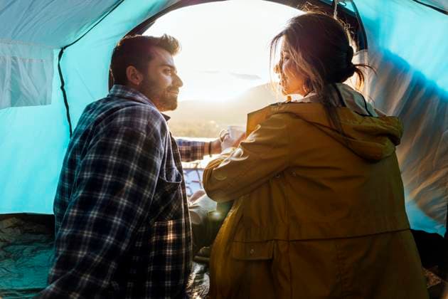 Couple spending vacation sitting in tent model released, Symbolfoto, JJF01039
