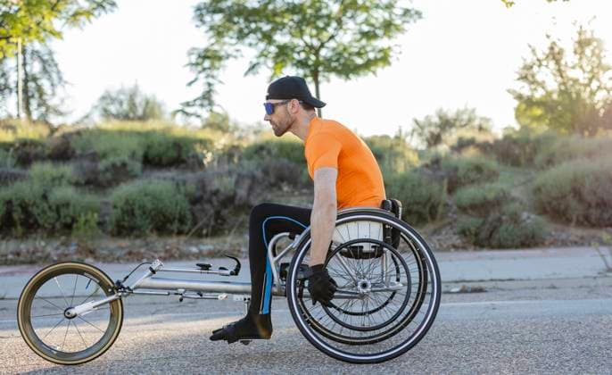 Mature athlete racing with wheelchair in competition on road model released, Symbolfoto, JCCMF10850