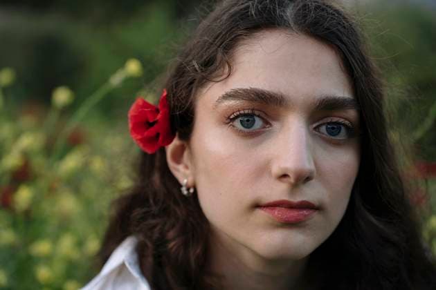 Young woman with poppy flower in hair model released, Symbolfoto, YBF00079