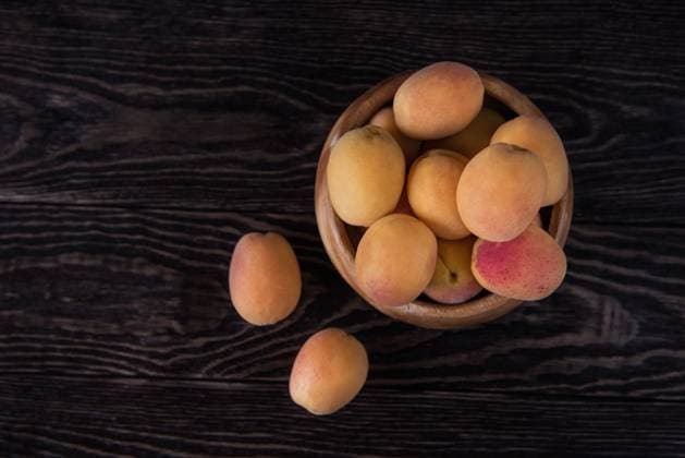 orange fresh apricots on a wooden background, model released, , 22499644.jpg, healthy, fresh, fruit, orange, ripe, vegetarian, apricot, closeup, natural, food, summer, yellow, sweet, organic, dessert, leaf, plant, juicy, background, white, color, season, nature, macro, wood, wooden, garden, diet, tasty, bio, design, group, art, green, bright, spring, space, object, outdoor, one, outside, flower, dark, red, vibrant, table, copy, seed, agriculture, RECORD DATE NOT STATED