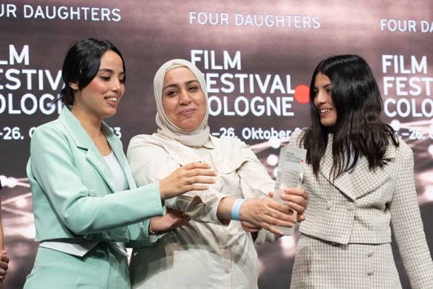 Olfa HAMROUNI with her daughters Eya and Tayssir, Phoenix Award for the film FOUR DAUGHTERS by director Kaouther Ben Hania, Film Festival Cologne awards in Cologne, 26 10 2022