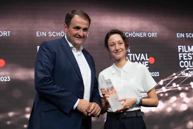 from left Nathanael LIMINSKI, Head of the State Chancellery NRW, Katharina HUBER, filmmaker, director, Katharina HUBER receives the Film Award NRW, Film Festival Cologne awards in Cologne, 26 10 2022