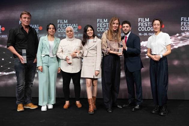 The award winners from left Actor Oliver MASUCCI International Actors Award Olfa HAMROUNI with her daughters Eya and Tayssir, Phoenix Award for the film FOUR DAUGHTERS by director Kaouther Ben Hania , director Justine TRIET Film Award Cologne , director Xavier DOLAN, The Hollywood Reporter Award , Katharina HUB