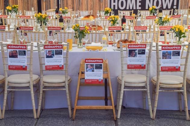 October 29, 2023, London, England, UK: The Empty Shabbat Table installation for the Israeli hostages held by Hamas. The installation, featuring set tables and empty chairs with posters of people and children held hostage by Hamas, is open to the public at the JW3 Jewish community centre in Finchley. London UK - ZUMAv130 20231029_zip_v130_011 Copyright: xVukxValcicx