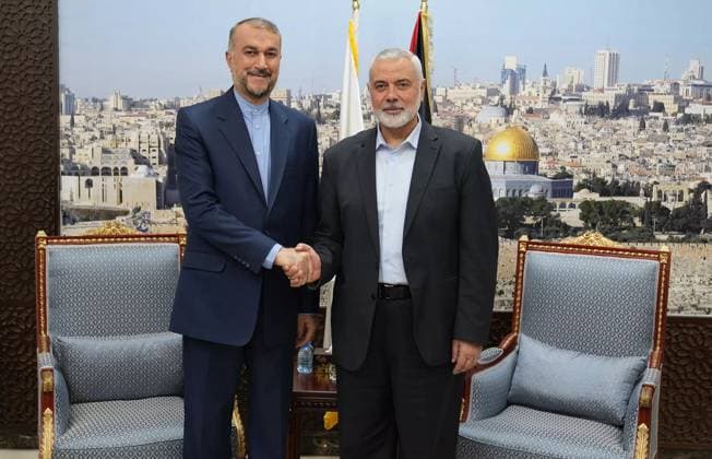 News Themen der Woche KW44 October 31, 2023, Doha, Qatar: Iranian Foreign Minister HOSSEIN AMIR-ABDOLLAHIAN (L) shakes hands with senior political Hamas leader and the current chairman of HamasÃ¢â‚¬â ¢s political bureau ISMAEL HANIYEH (R). The meeting was held to discuss the situation in the Gaza Strip. Thousands of Israelis and Palestinians have died since the militant group Hamas launched an unprecedented attack on Israel from the Gaza Strip on 07 October, and the Israeli strikes on the Palestinian enclave which followed it. Doha Qatar - ZUMAi98_ 20231031_zih_i98_013 Copyright: xIranianxForeignxMinistryx