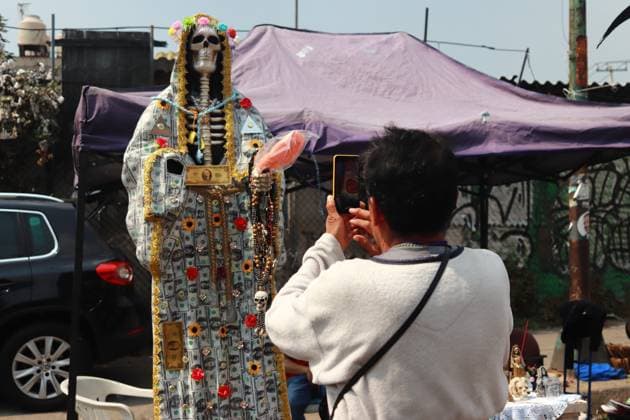 22nd Anniversary of the Cult of Santa Muerte October 31, 2023 in Mexico City, Mexico: Hundreds of devotees of the Santa Muerte also known as White Girl visit the altar located at Morelos colony, to celebrate the 22nd anniversary of its founding, in the brave neighborhood of Tepito. On October 31, 2023. In Mexico City. (Photo by Carlos Santiago Eyepix Group) Copyright: xCarlosxSantiagox xEyepixxGroupx CS202310317854