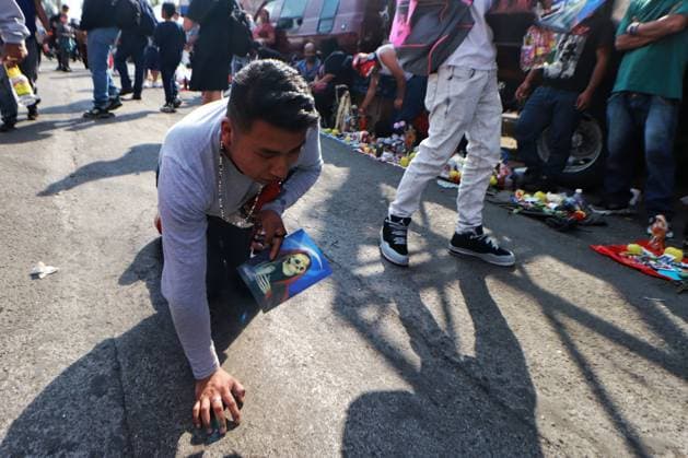 October 31, 2023 in Mexico City, Mexico: Hundreds of devotees of the Santa Muerte also known as White Girl visit the altar located at Morelos colony, to celebrate the 22nd anniversary of its founding, in the brave neighborhood of Tepito. On October 31, 2023. In Mexico City. Mexico City Mexico - ZUMAe321 20231031_zia_e321_006 Copyright: xCarlosxSantiagox